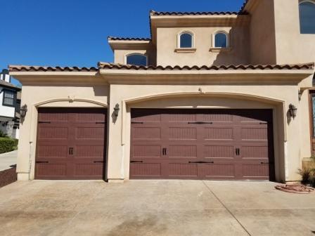 Wood Look Garage Doors with Windows and Black Hardware