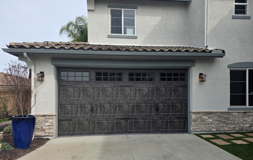 Two Car Garage Doors that look like wood.