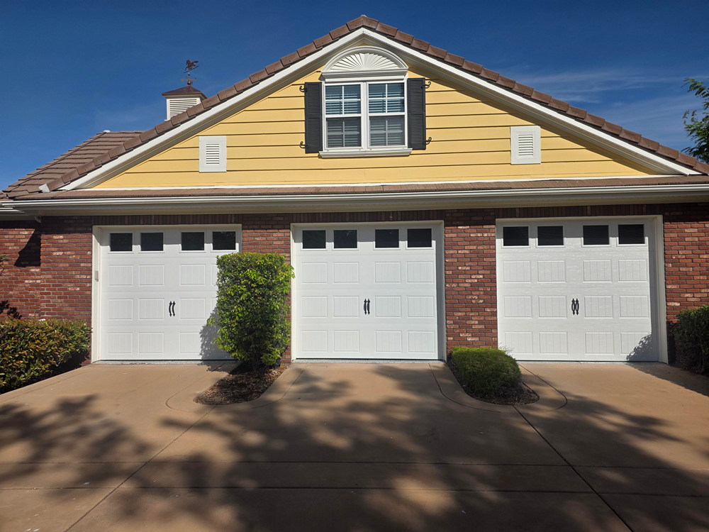 Three Single Garage Doors with windows.
